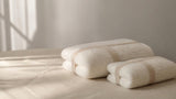 Willow and Fern folded cotton bath towel and hand towel set styled to show the size difference between the large and small towel