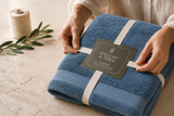 Folded premium cotton towel set showing weave density